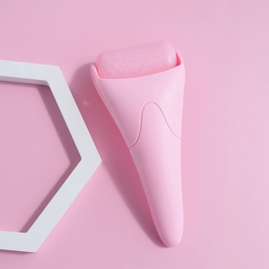 Detailed macro view of pink textured ice roller for facial skincare and cooling massage