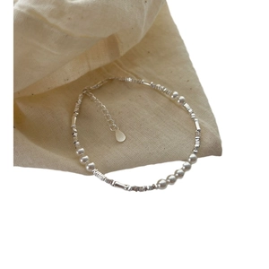Minimalist S925 sterling silver pearl beaded bracelet with adjustable chain on cotton bag