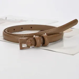 Women's slim brown leather belt with refined stitching and matching pin buckle for trousers