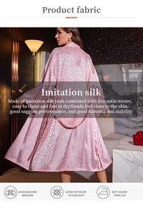 Detail of pink leopard print satin robe showing smooth fabric texture and drape from back view