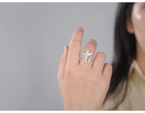 Macro detail of S925 sterling silver iris flower and butterfly leaf adjustable open ring