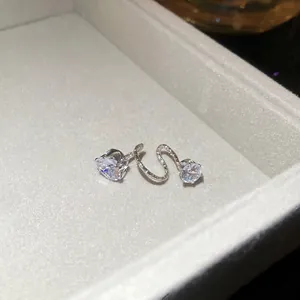 Elegant silver drop earrings set with sparkling round zircons in a premium jewelry box