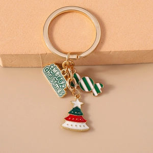Detail of Christmas keychain with Merry Christmas plaque, green tree and candy cane charms