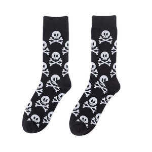 Detail of crew socks with white pirate skull and crossbones pattern on black cotton fabric