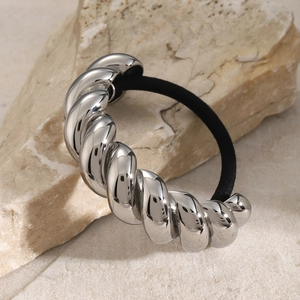 Sleek stainless steel twisted croissant hair tie with black elastic band on stone