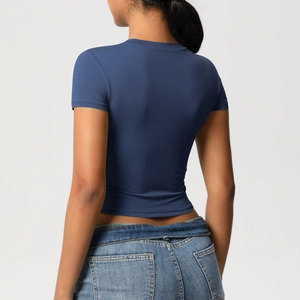 Rear view of tight-fit navy blue short sleeve yoga top in soft breathable fabric