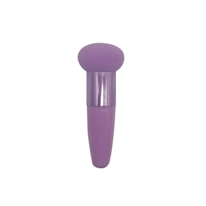 Purple mushroom beauty sponge with ergonomic plastic handle for professional makeup application