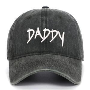 Close-up of white DADDY embroidery on vintage washed grey denim baseball cap fabric
