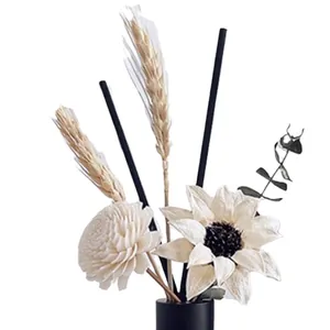 Modern white dried flower bouquet with sunflower and wheat in a sleek black ceramic vase