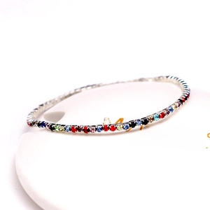 Detail showing colorful rhinestones on a 2.0mm silver elastic bridal bracelet