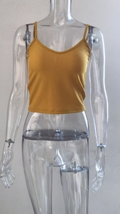Detail view of mustard yellow ribbed knit camisole top with slim fit cropped design