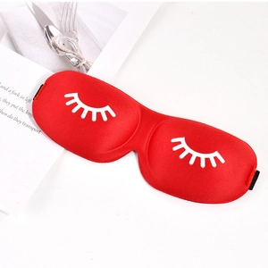 Detailed view of red 3D sleep mask with eyelash pattern and breathable contoured design