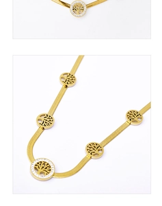 Macro detail of gold-plated snake chain with sparkling rhinestone Tree of Life pendants
