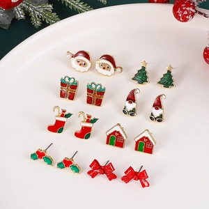 Festive Christmas stud earring set featuring Santa, tree, and gift box designs