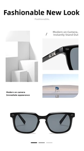 Close-up of black square sunglasses with silver geometric accents and grey tinted lenses