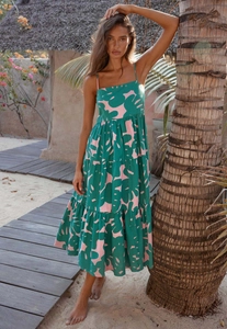 Detail of tiered tropical print maxi dress with spaghetti straps and green palm leaf pattern