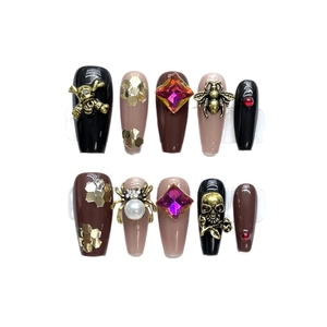 Gothic 3D press-on nails with skull, spider and gemstones in black and vintage style