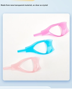 Macro shot of three transparent plastic eyelash shields in pink and blue colors