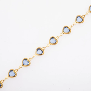 Close-up of golden titanium steel chain featuring multiple transparent blue heart charms