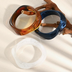 Pentagon twisted acrylic bracelets in amber tortoiseshell and blue sand textures