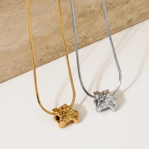 Minimalist gold and silver irregular lava pendant necklaces on snake chains