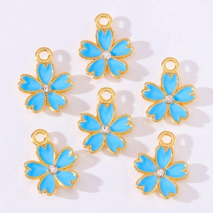 Detail of blue cherry blossom pendants with gold edges and central sparkling crystals
