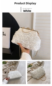 Detail of white evening clutch with 3D chiffon roses and sparkling rhinestone clasp