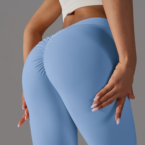 Close-up of light blue yoga pants featuring high waist and scrunch butt lifting detail