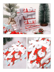 Detail of Christmas kraft wrapping paper with reindeer and tree patterns for holiday gifts