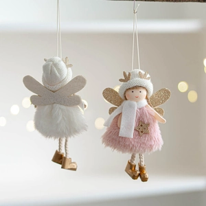 Close-up of plush angel ornaments with knit hats, golden antlers, and soft texture details
