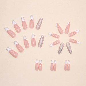 Long ballerina press-on nails with white French tips and sparkling silver glitter accents