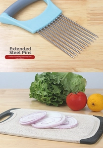 Detail of stainless steel onion holder with long prongs for even vegetable slicing