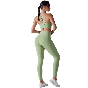 Two-piece light green yoga set with cross-back sports bra and high-waist leggings