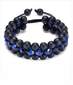 Detailed view of three-layer beaded bracelet with blue tiger eye and matte black stones
