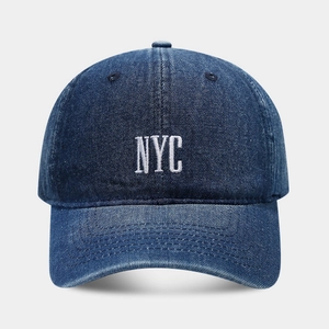 Retro dark blue denim baseball cap with white NYC embroidery and curved brim