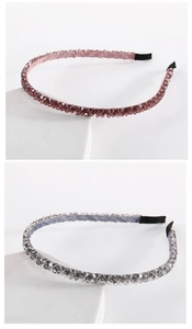 Detail of handmade double-row crystal beaded headbands in purple and grey colors
