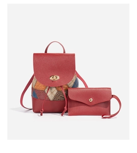 Detail of red quilted mini backpack with matching envelope coin purse and gold twist lock