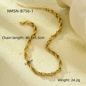 Detail of golden twisted rope chain necklace showing length and width measurements