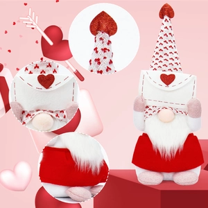 Macro shot of Valentine gnome plush featuring heart patterns and felt envelope detail