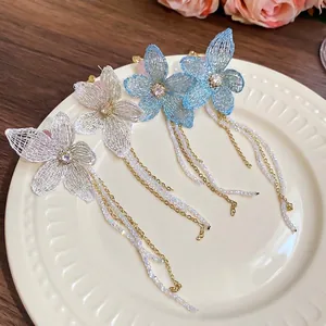 Floral zircon fringe earrings with silver needle featuring blue knitted flower petals