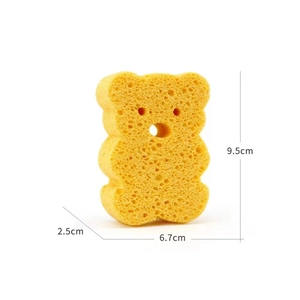 Yellow cartoon bear wood pulp baby bath sponge measuring 9.5x6.7x2.5cm for gentle cleaning