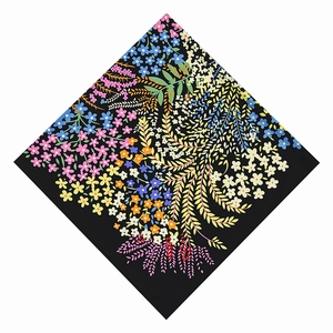 Detail of colorful floral pattern on black twill square scarf with vibrant botanical print