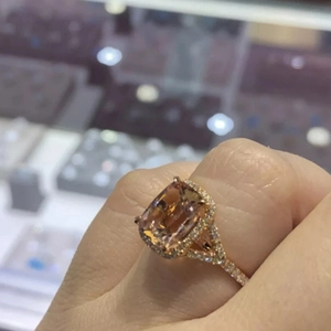 Rose gold engagement ring featuring cushion-cut champagne zircon in halo split-shank setting