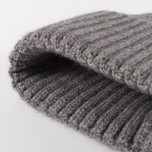 Grey ribbed knit beanie hat for women featuring soft wool texture and classic thick weave