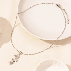 Detailed view of seahorse pendant necklace with refined silver finish and lobster clasp