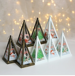 Detail view of decorative Christmas pyramid lanterns with festive prints and top rings
