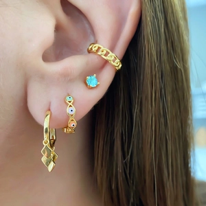 Close-up of S925 sterling silver evil eye enamel hoops and gold stud earrings set