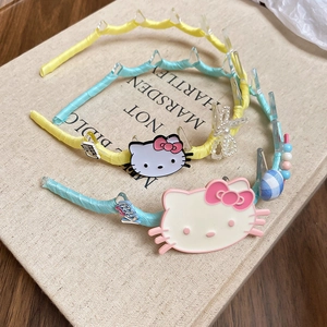 Detail of fabric cat headbands with non-slip teeth and colorful cute ornaments