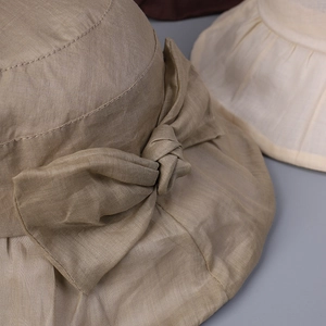 Breathable linen sun hat for women with large brim and elegant bow decoration