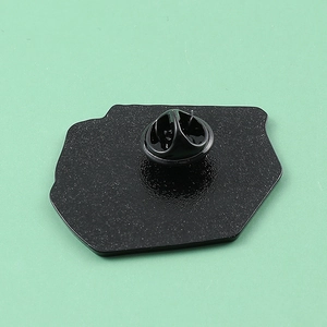 Detailed back view of enamel pin with secure black rubber clutch on metal base
